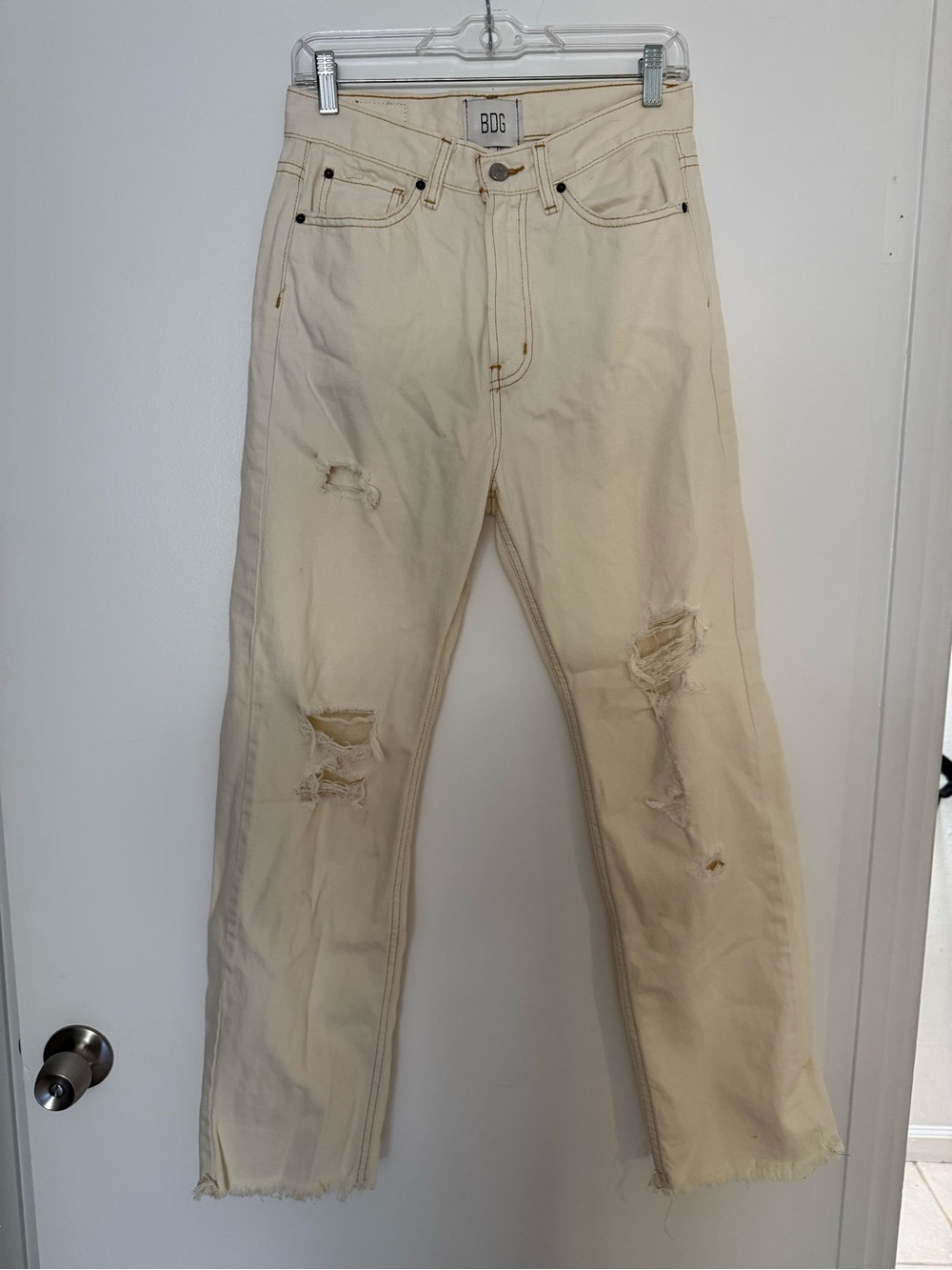 BDG Urban Outfitters cream distressed denim jeans with ripped details